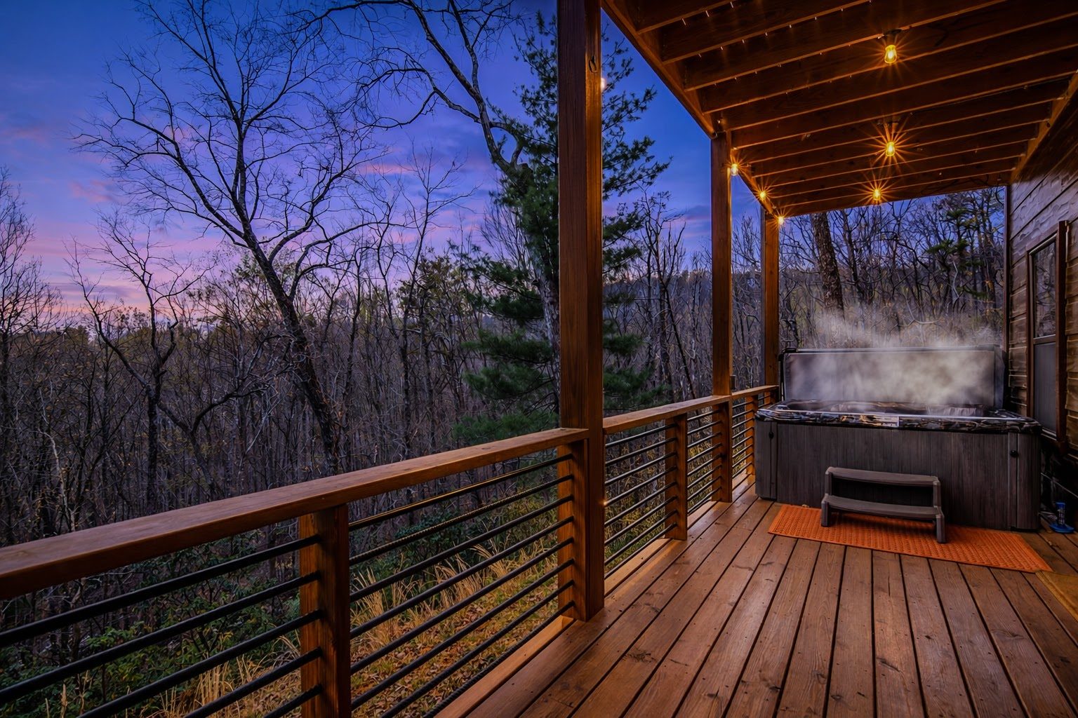 Hot tub on covered porch at sunset